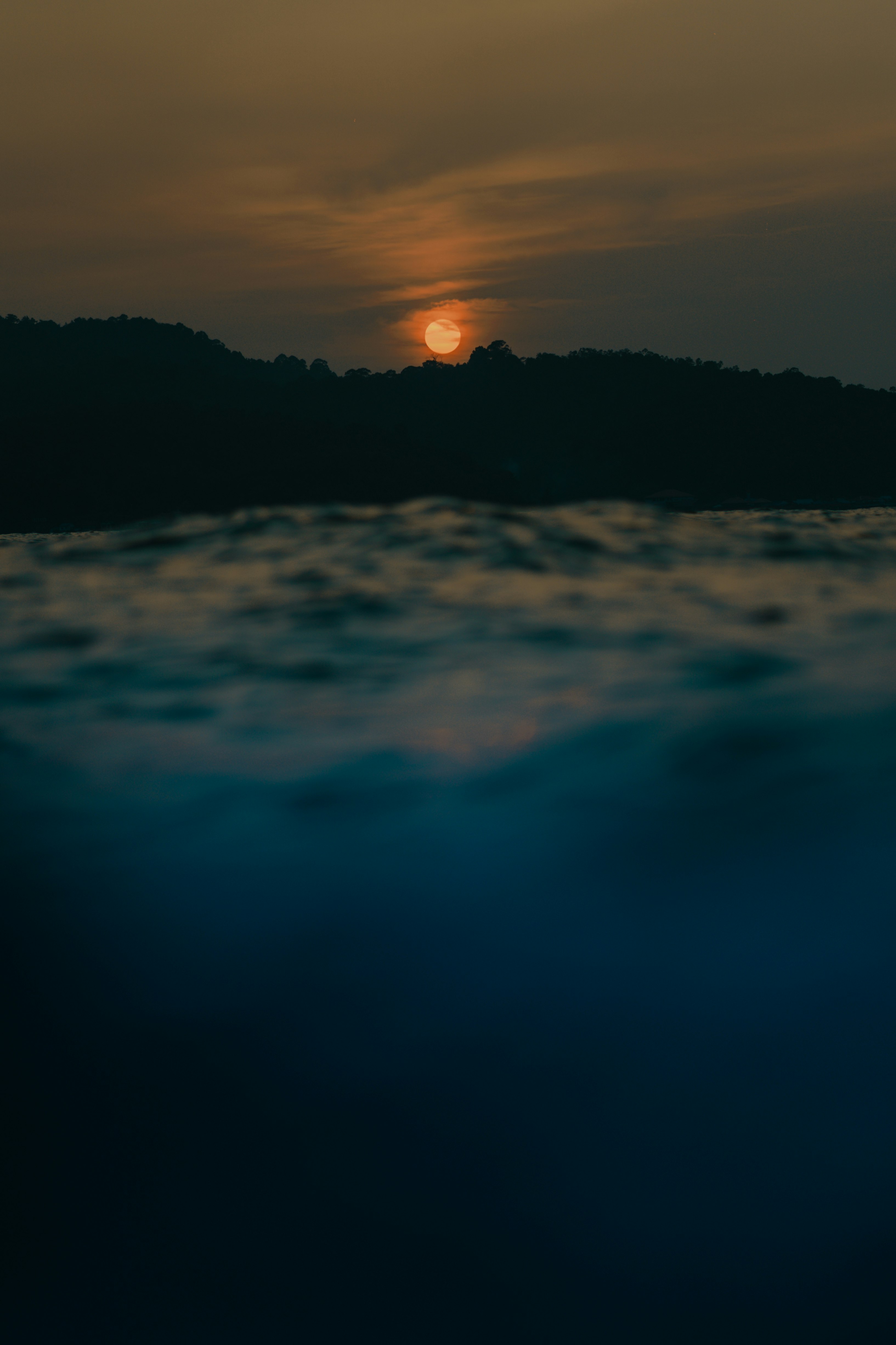 silhouette of mountain during sunset